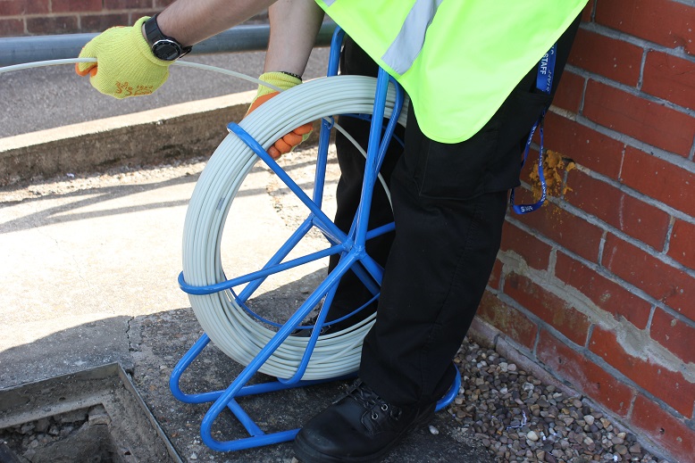 Checking the ducting to see if we can get a fibre down it.